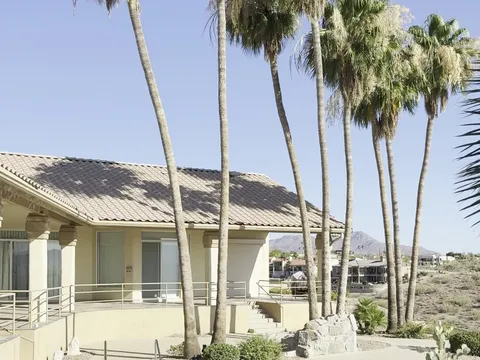 Before — Hillside Fountain Hills AZ stucco home with pool after full exterior repaint in warm cream